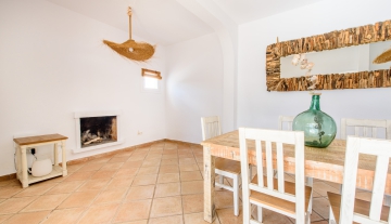 resa estates ibiza for sale house  ses salines 2022 finca dining and fireplace.jpg